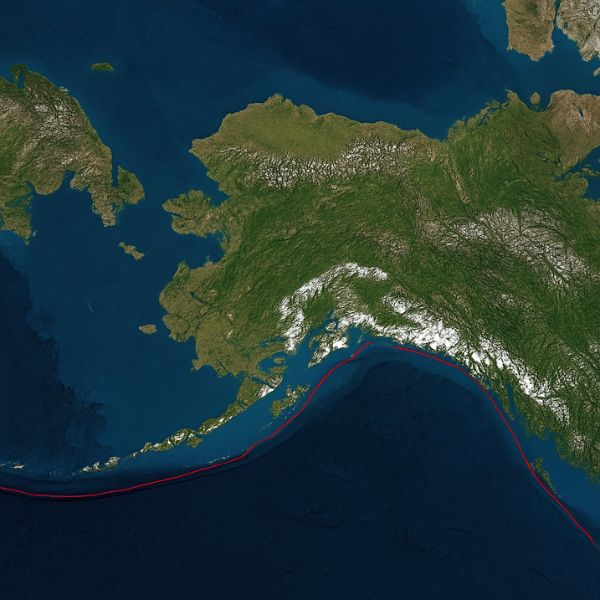 AI generated image of Satellite view of Alaska showing the tectonic boundary where the Pacific Plate collides with the North American Plate, forming mountain ranges, volcanic islands, and deep ocean trenches