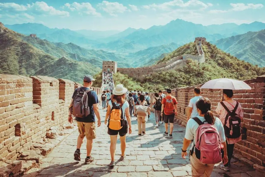 visitors walking on Great Wall of China historic landmark travel view