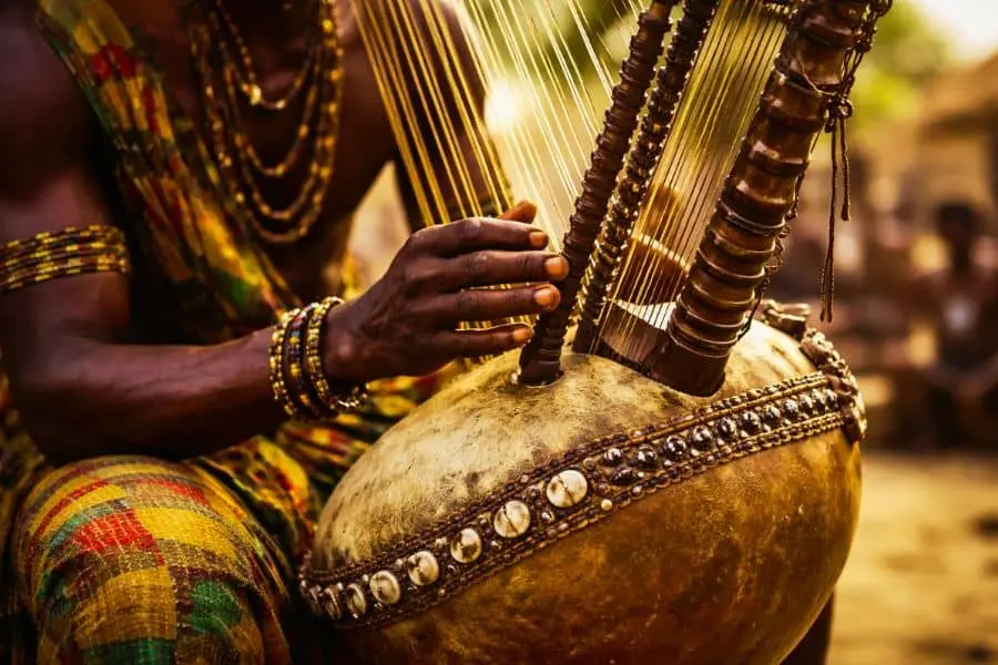 kora instrument used in traditional African music history and culture