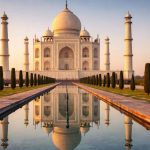 Taj Mahal in Agra, India photographed at sunrise showing white marble Mughal architecture