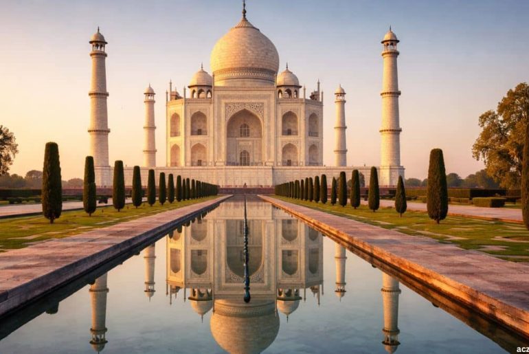 Taj Mahal in Agra, India photographed at sunrise showing white marble Mughal architecture