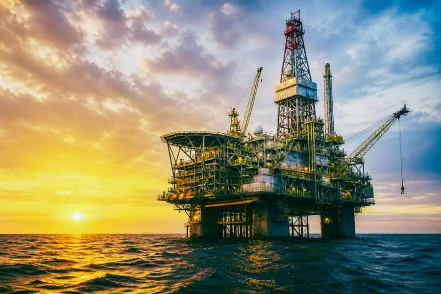modern offshore oil rig petroleum exploration technology deep sea drilling platform sunset